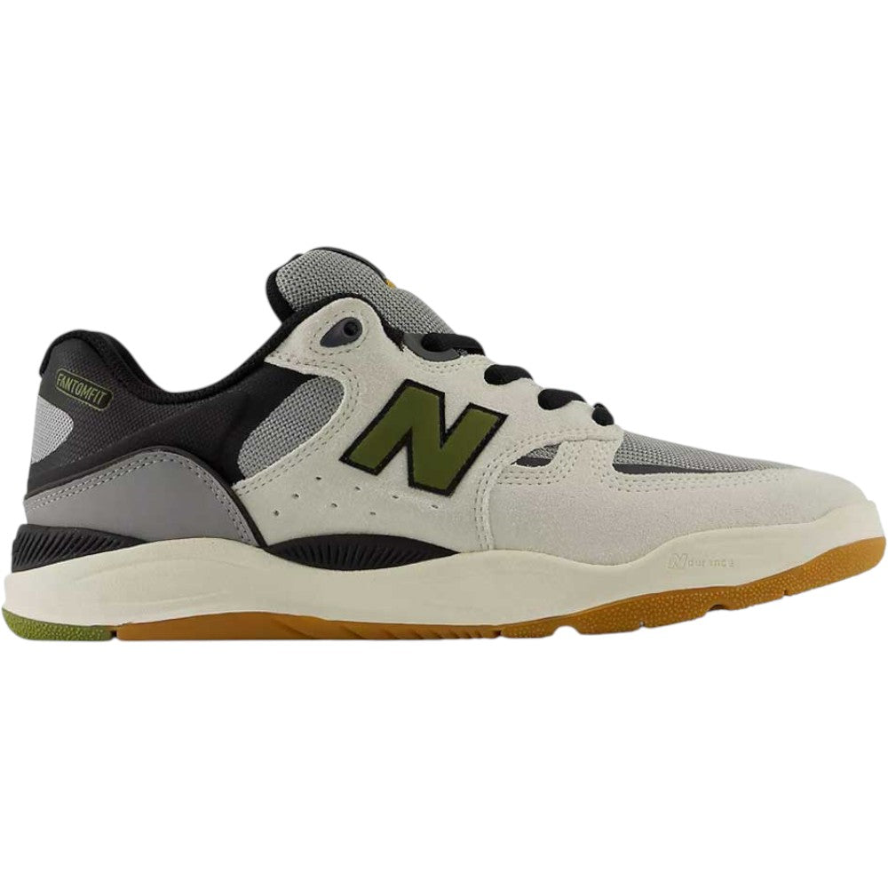 The 1010 B Tiago Lemos Sea Slate Dark Olivine New Balance Numeric Suede Skateboarding Shoe features a beige suede upper with an olive green N logo, black and gray accents, a white midsole equipped with responsive FuelCell foam, and a gum rubber outsole. This Tiago Lemos skate shoe is shown in a side profile view.