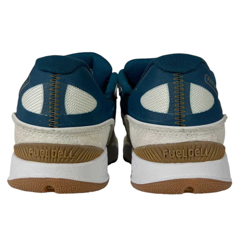 Shown from the back, these New Balance Numeric 1010 BL Tiago Lemos skateboarding shoes feature blue uppers, white mesh, beige suede accents, brown rubber soles, and FUELCELL on the heels.