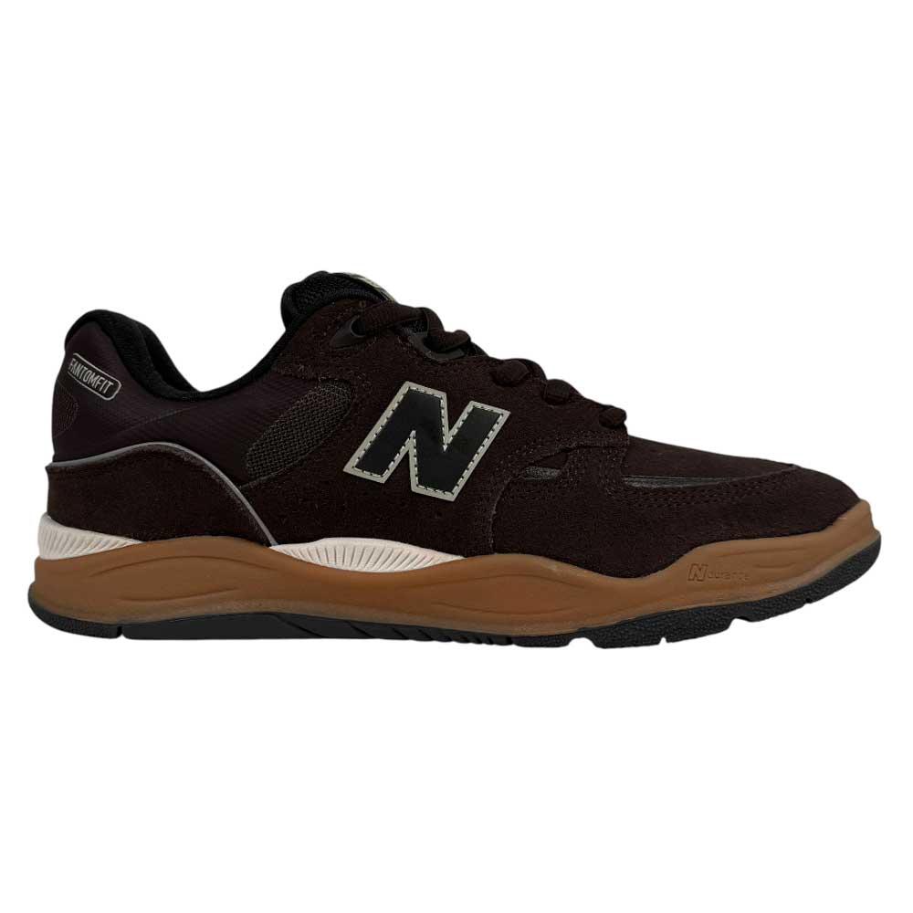 The 1010 BN Tiago Lemos Brown Black Suede New Balance Numeric Skateboarding Shoe features a mesh and suede upper, black laces, white logo, and brown rubber sole—inspired by the Tiago Lemos pro model for top skate performance. Shown side view on white.