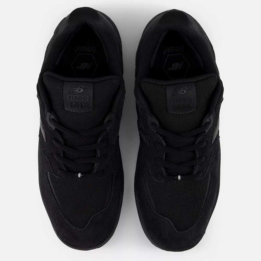 A pair of 1010 CR Tiago Lemos Black New Balance Numeric Suede Skateboarding Shoes seen from above, featuring laces, TIAGO branding on the tongues, and a durable ABZORB midsole for comfort.