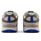 Rear view of 1010 SV Village Psychic Tiago Lemos Gray Blue Suede New Balance Numeric Skateboarding Shoes featuring gray, blue, and beige suede uppers, mesh panels, and blue accents on the heel and sole.