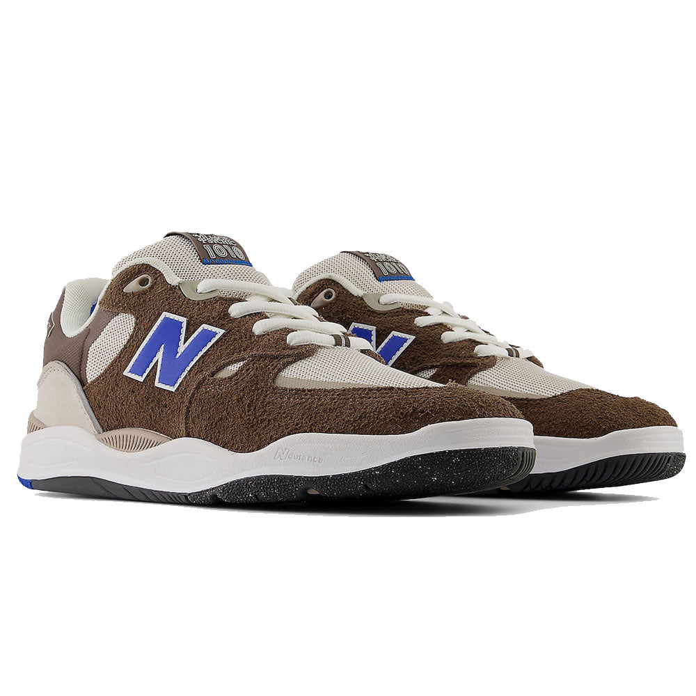 The 1010 SV Village Psychic Tiago Lemos Gray Blue Suede New Balance Numeric Skateboarding Shoes feature brown suede overlays, white mesh panels, blue N logos, white laces, and black speckled rubber soles.