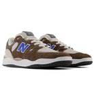 The 1010 SV Village Psychic Tiago Lemos Gray Blue Suede New Balance Numeric Skateboarding Shoes feature brown suede overlays, white mesh panels, blue N logos, white laces, and black speckled rubber soles.