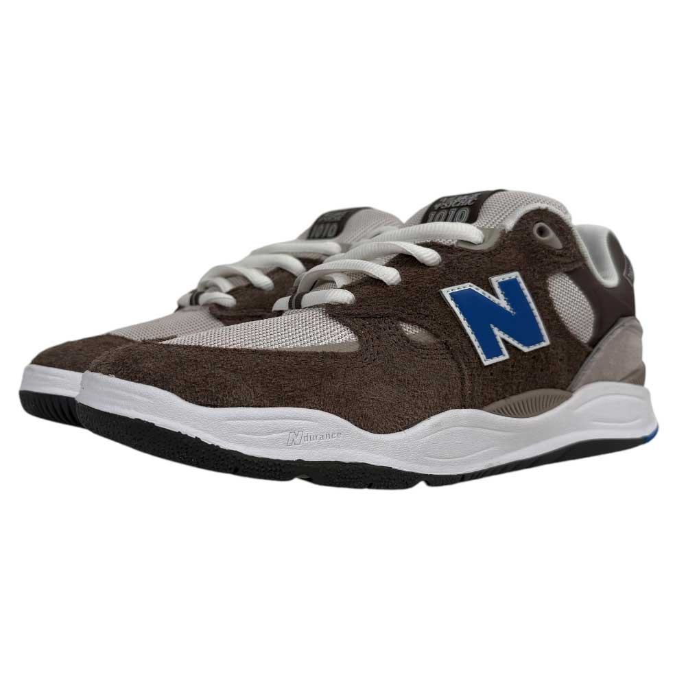 The 1010 SV Village Psychic Tiago Lemos Gray Blue Suede New Balance Numeric skate shoes feature brown suede overlays, gray mesh, blue N logos, white laces, white FuelCell midsoles, and black outsoles.