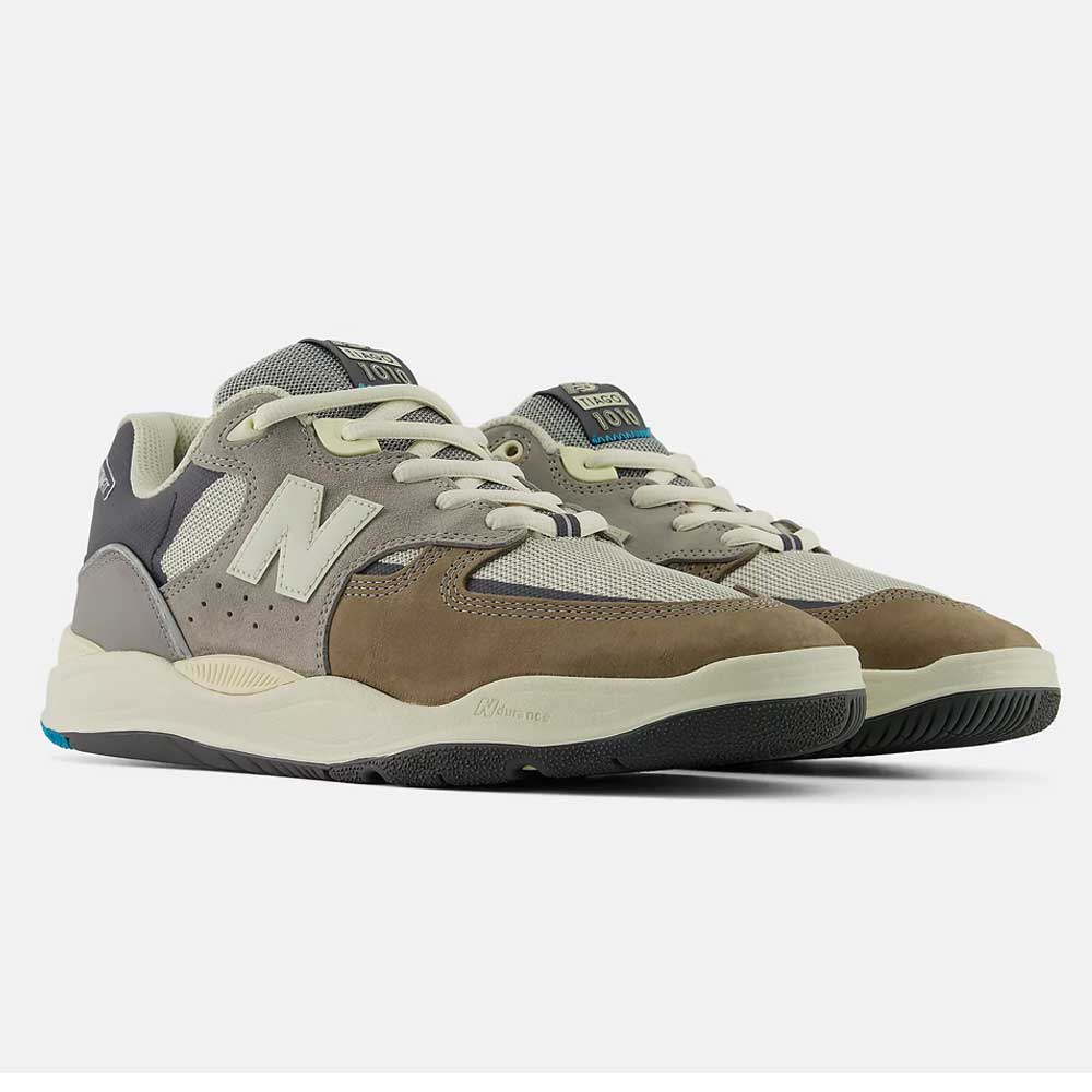 The 1010 Y Tiago Lemos Gray Day Marble Head Island Blue New Balance Numeric Suede Skateboarding Shoes feature brown, beige, and gray hues with cream laces and the N logo, shown against a plain white background.