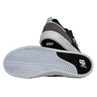 A pair of 306 TRI New Balance Numeric Jamie Foy Suede Shoes in grey and black—one displays the upper, the other shows the white textured sole with a black New Balance logo—perfect as durable skateboarding footwear.