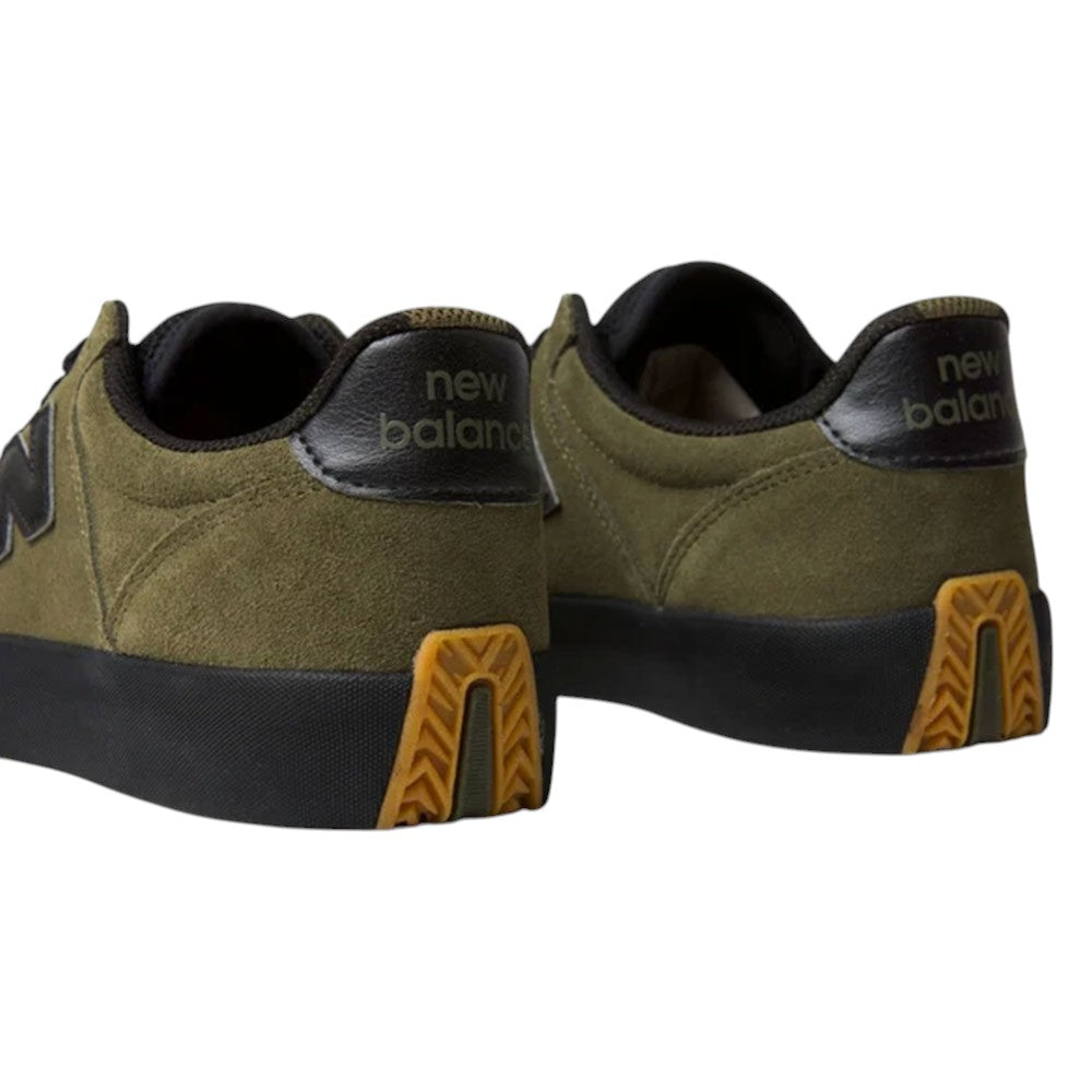 340 IWT New Balance Numeric suede skateboarding shoes in olive green with a reinforced toe cap, black midsoles, and patterned gum rubber heel inserts for impact protection.