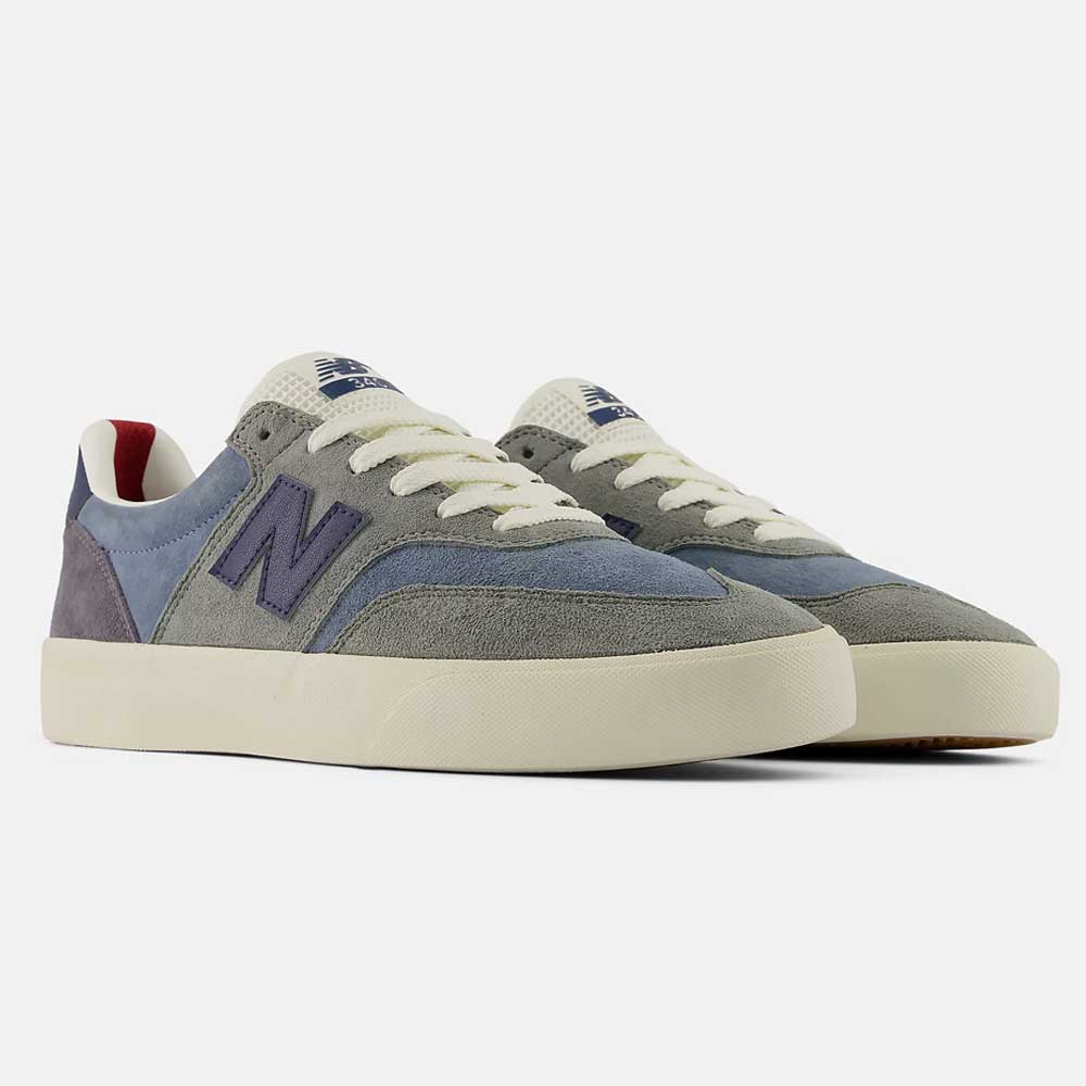 A pair of 340 NBA Gray Blue Green New Balance Numeric Suede Skateboarding Shoes featuring grey and blue suede panels, white laces, and cream-colored soles. The iconic N logo appears on the sides, complemented by a reinforced toe cap for enhanced durability and impact protection during everyday wear.
