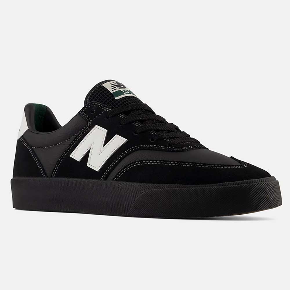 A pair of 340 YRW Black White New Balance Numeric Suede Skateboarding Shoes, featuring a sleek black suede upper with a white “N” logo on the side, black laces, a white heel patch, and a thick black sole with a reinforced toe cap for enhanced durability and impact protection, displayed against a light gray background.