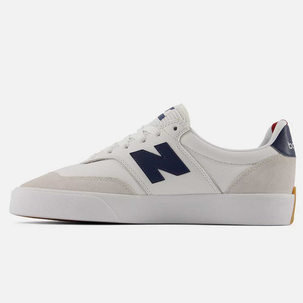 The 340 YRW New Balance Numeric Suede Skateboarding Shoes feature a white design with navy blue N logo, suede toe and heel accents, and a durable white rubber sole. The reinforced toe cap ensures added durability, while the heel sports a navy blue section with “balance” in white letters.