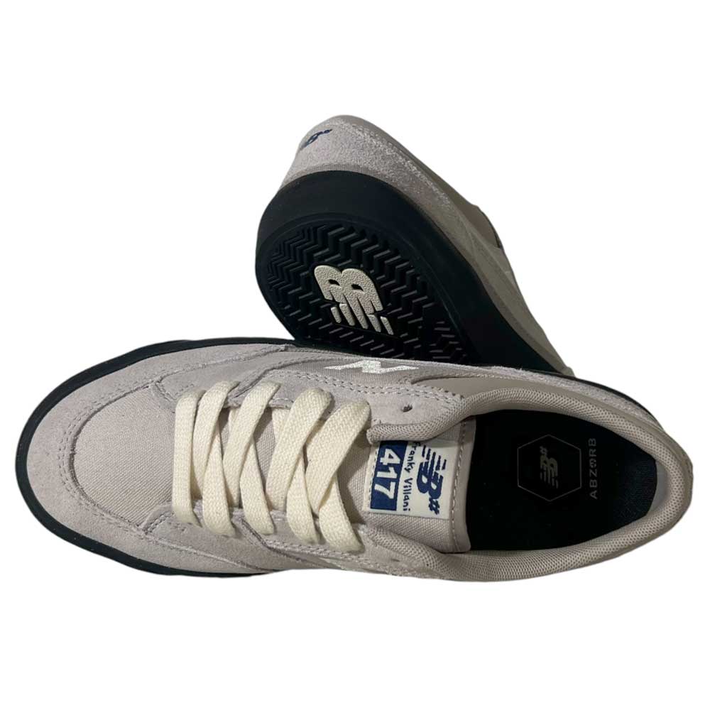 A pair of New Balance Numeric 417 LSB Franky Villani Grey Black Suede skateboarding shoes featuring white laces, black soles, and visible branding. One shoe stands upright; the other lies on its side to showcase the durable sole.
