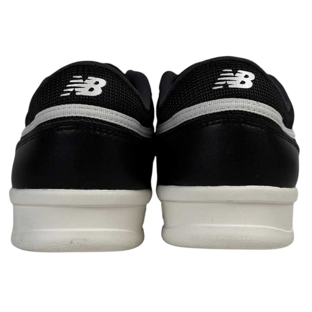 A rear view of the 430 BWH New Balance Numeric Suede Skateboarding Shoes in black and white, featuring white soles, a cushioned midsole, and the white NB logo on the back of each shoe.