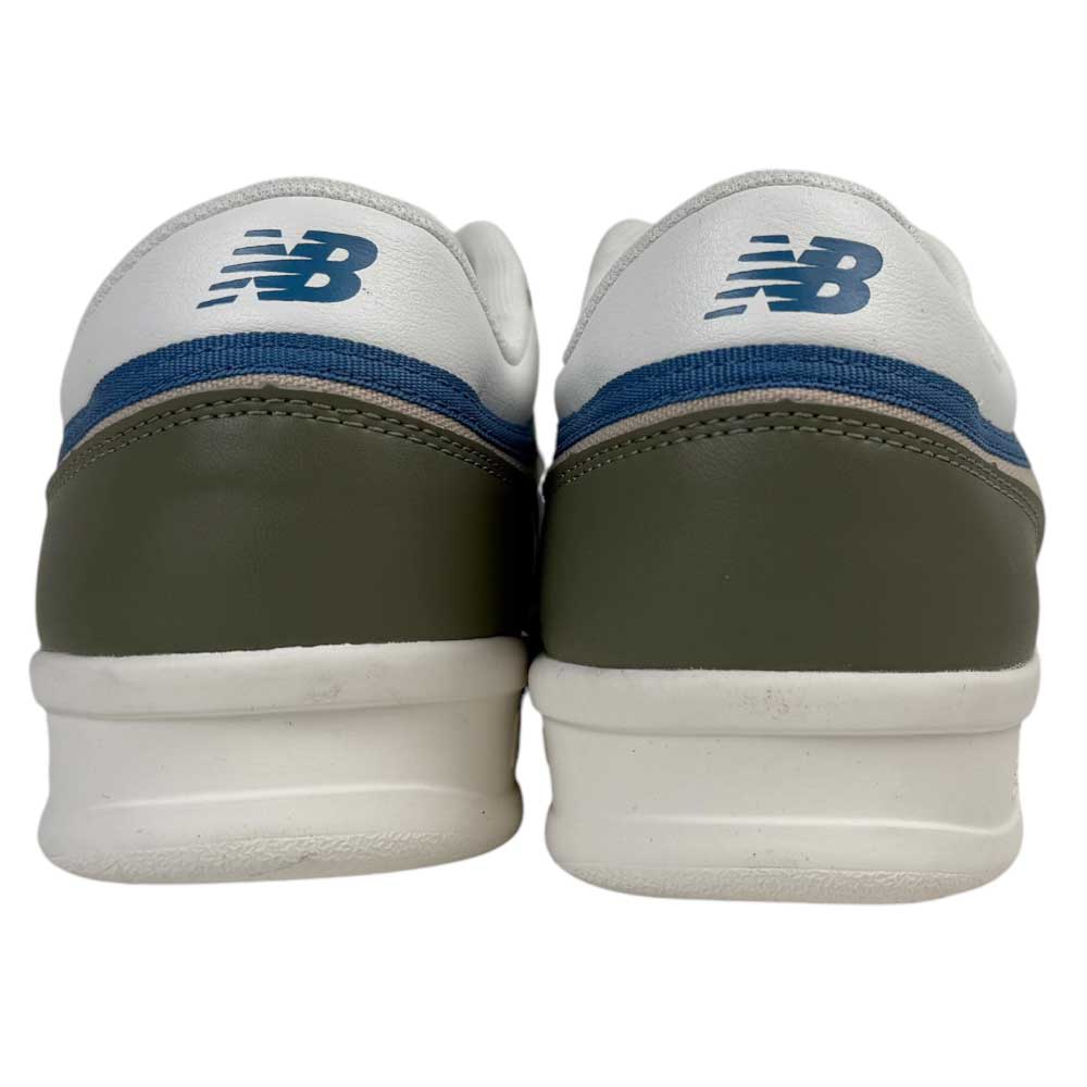 The 430 CZY New Balance Numeric Suede Skateboarding Shoes feature white uppers, dark green heels, blue stripes, and blue NB logos at the back. Their court-inspired design includes a cushioned midsole for all-day comfort.