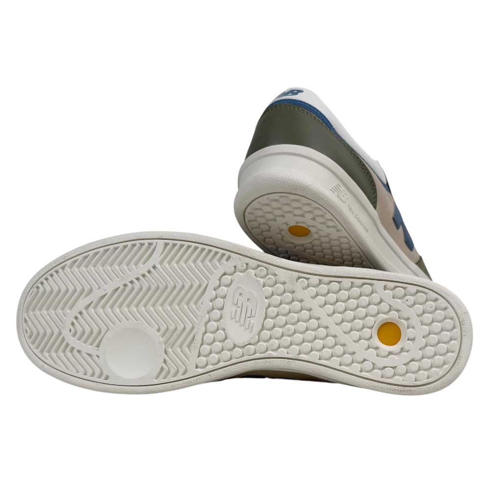 The 430 CZY New Balance Numeric Suede Skateboarding Shoes feature cushioned midsoles, white textured rubber soles with circular and herringbone patterns, and beige uppers with blue and green accents.