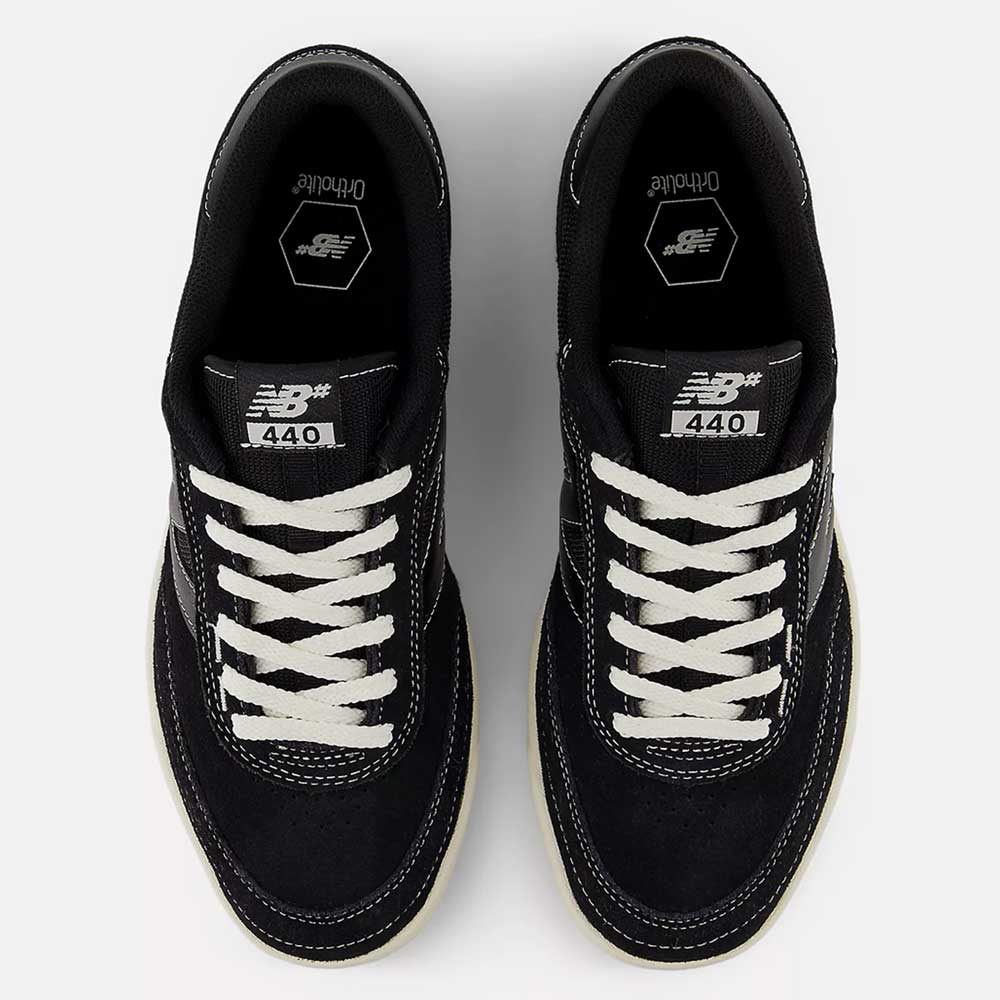 Top view of 440 BCO Black White New Balance Numeric Suede Skateboarding Shoes, with white laces and stitching, Ortholite insoles, a durable ABZORB midsole, and New Balance logos visible on the tongues.