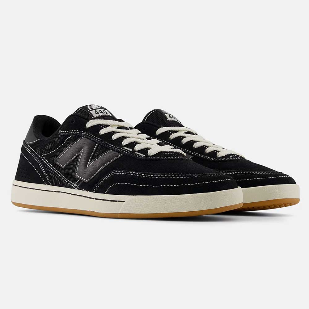 The 440 BCO Black White New Balance Numeric Suede Skateboarding Shoes feature black suede, white soles, grey N logos, ABZORB midsole for comfort, white stitching, and laces, displayed on a plain light background.