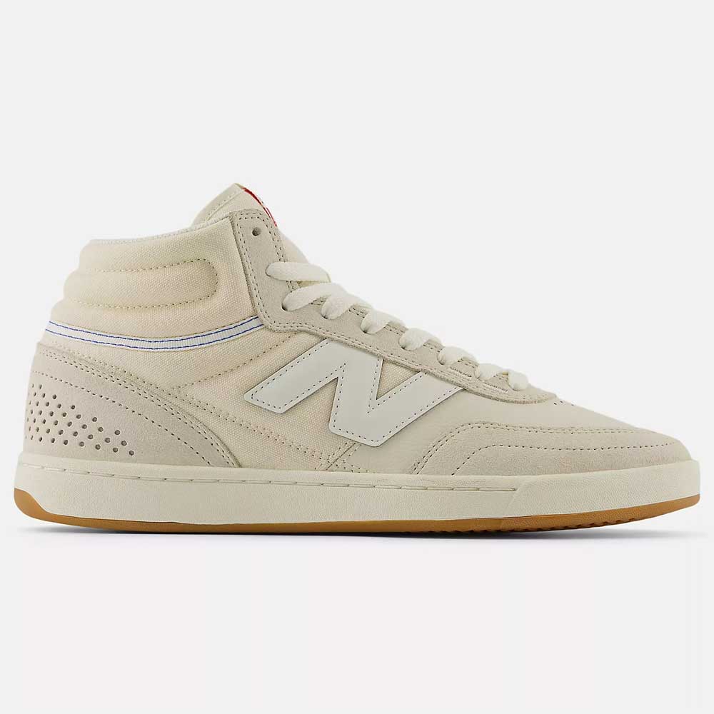 The 440 HTW Timberwolf White New Balance Numeric Suede Skateboarding Shoe features a beige high-top design, white laces, white N logo, perforated heel details, durable ABZORB midsole, and a light brown rubber sole.