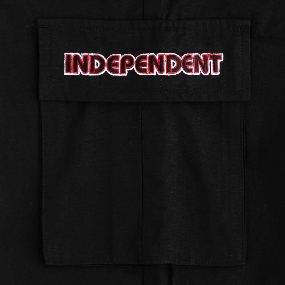 The 44643574 Groundwork Cargo Pants in black ripstop feature a bold red and white INDEPENDENT embroidery on the pocket flap, capturing the signature style of Independent Trucks mens apparel.