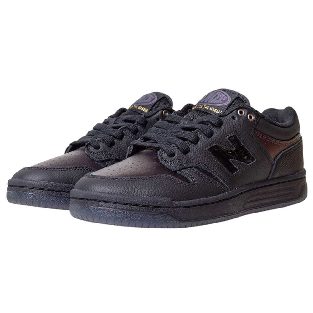 A pair of 480 BFK Bronze 56K New Balance Numeric Skateboarding Shoes in suede black iridescent, with black laces and purple-gold accents on the tongue and side logo, shown from a front-side angle.