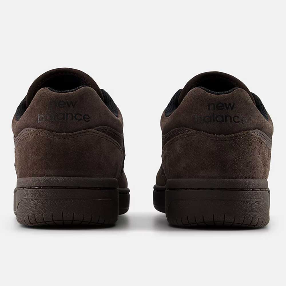 Rear view of Chocolate Brown 480 CHC New Balance Numeric suede skateboarding shoes with black accents and a visible New Balance logo on the heels, displayed against a plain light background.