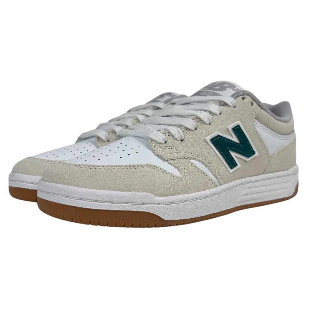 The 480 JDI New Balance Numeric Shoes feature white and beige suede uppers, green N logos, a reinforced toe cap, white laces, and brown rubber soles, displayed on a plain white background.