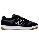 The 480 MGC New Balance Numeric Shoes in Suede Black Dark Grey feature a white N logo, white midsole, and gum rubber outsole with a durable leather upper, shown in a side profile view.