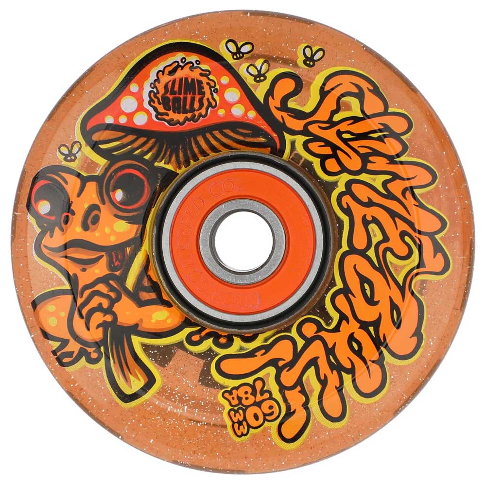 The 60mm Frog Trips Light Ups OG Slime Red Glitter 78a Slime Balls wheel features a cartoon frog with a mushroom, yellow slime lettering, buzzing flies, and LEDs for a playful, eye-catching skateboard ride.