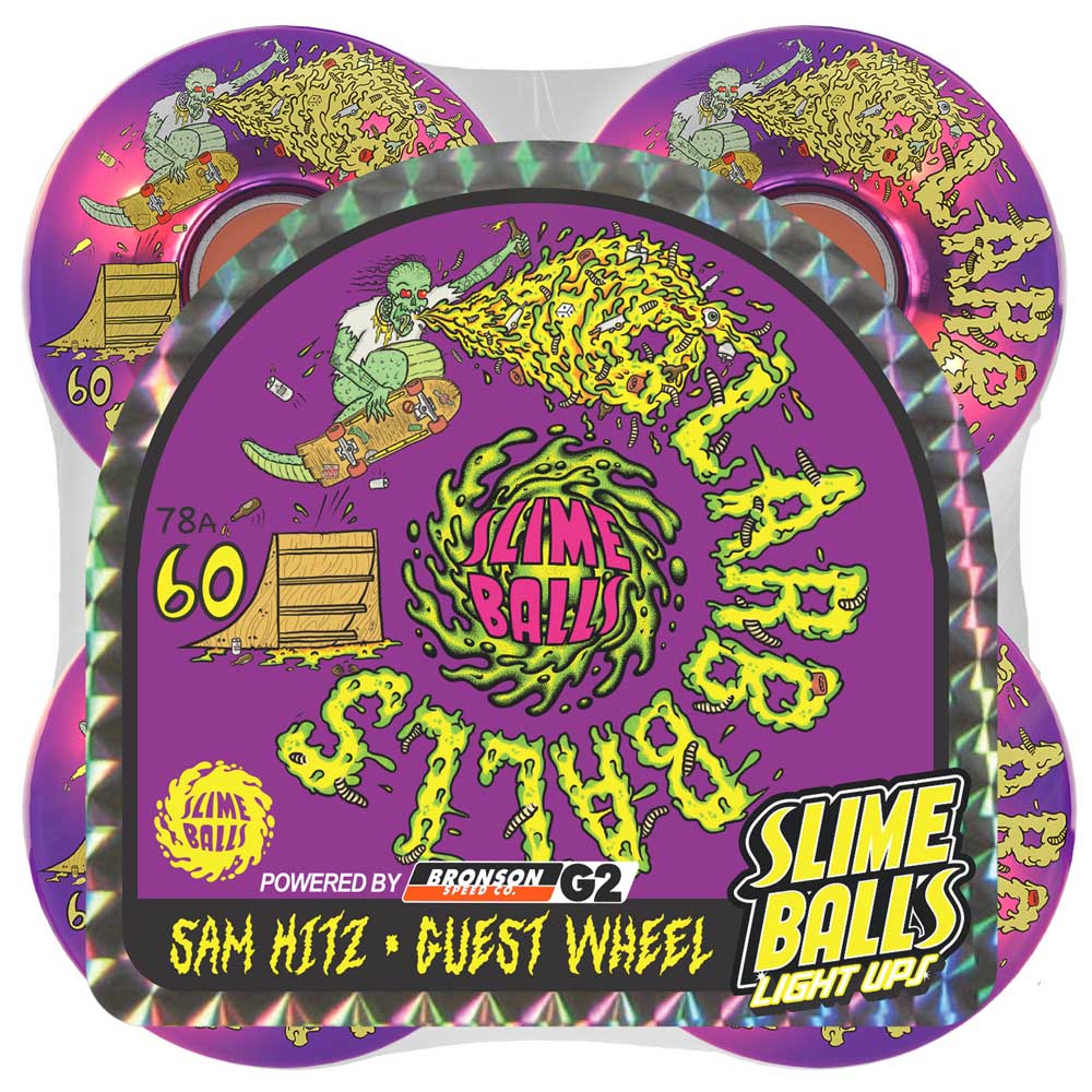 The 60mm Sam Hitz Light Ups OG Slime Purple 78a Slime Balls Wheels come in vibrant purple packaging adorned with a cartoon zombie on a skateboard and green slime graphics. Featuring a light-up design and the Sam Hitz Slime Balls Guest Wheel artwork, these wheels are perfect for adding extra style to your ride.