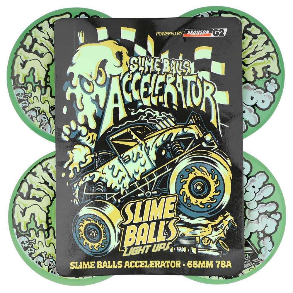 A set of four 66mm Accelerator Light Ups OG Slime Transparent Green 78a Slime Balls skateboard wheels glow in the dark, featuring cartoon slime graphics and packaged with a slime monster truck card.