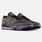 A pair of 770VWX Grey Olive Purple New Balance Numeric Suede Skateboarding Shoes, featuring black laces, olive and purple accents, and a chunky sole, are side by side on a white background. Designed for style and court stability.