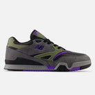 The 770VWX Grey Olive Purple New Balance Numeric Suede Skateboarding Shoes feature a gray suede upper with olive green and purple accents, black laces, and a black/purple outsole. The NB logo adds style and stability for skateboarding performance.
