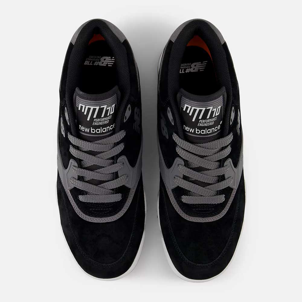 Top view of black and gray 770YZZ Black White New Balance Numeric Suede Skateboarding Shoes featuring "new balance" and "Made in England" on the tongue, gray laces, and white midsoles—perfect for skateboarding court stability.