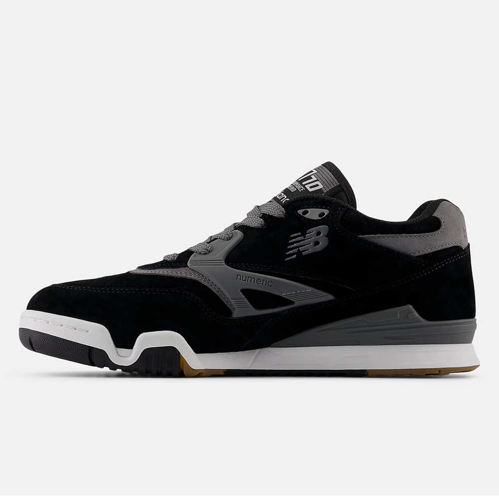 Side view of the 770YZZ Black White New Balance Numeric Suede Skateboarding Shoes featuring a black and gray upper, gray N logo, white midsole, and gum rubber outsole for court stability against a plain white background.