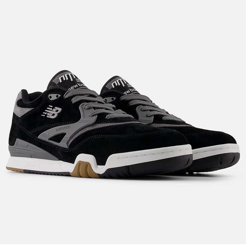 A pair of 770YZZ Black White New Balance Numeric suede skateboarding shoes with white midsoles and gum rubber outsoles, designed for court stability, displayed on a plain white background.