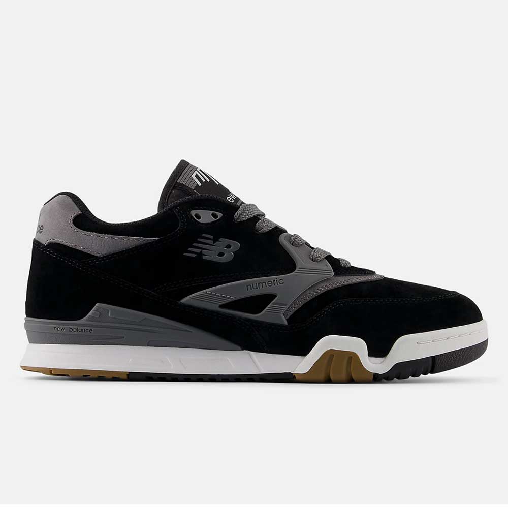 The 770YZZ Black White New Balance Numeric Suede Skateboarding Shoe features a black and gray design, white sole, light gray laces, gum outsole accents, and side New Balance logo, seen from the left.