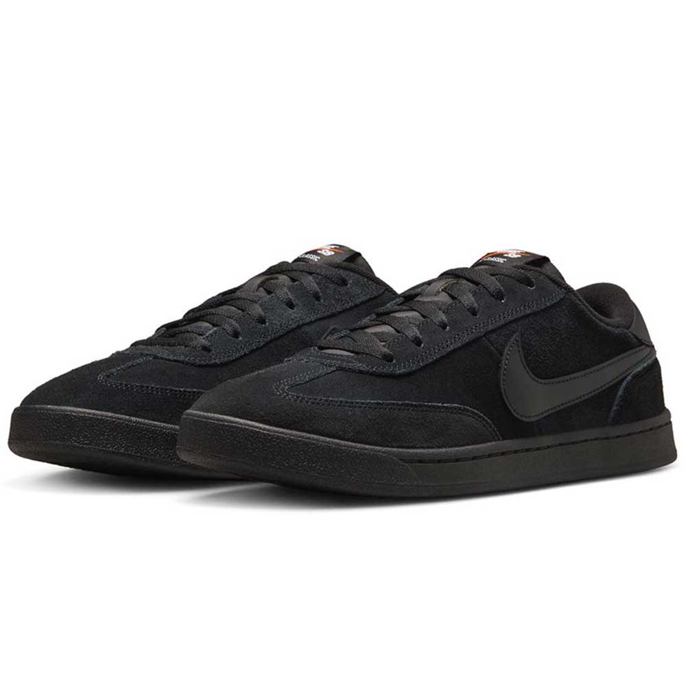 A pair of 909096002 Black Vivid Orange FC Classic Nike SB suede skateboarding shoes with a low-top design, black laces, Solarsoft insole for comfort, and the Nike Swoosh logo, displayed on a white background.