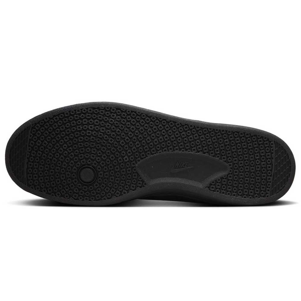 The image shows the black rubber outsole of the 909096002 Black Vivid Orange FC Classic Nike SB Suede Skateboarding Shoes, featuring a circular traction pattern at the forefoot and the Nike logo embossed at the midfoot.