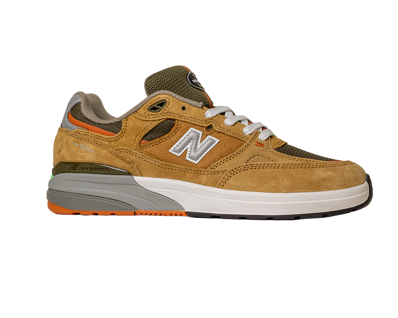 The 933 MNO Andrew Reynolds Brown Grey New Balance Numeric skateboarding shoe features suede and mesh panels, white laces, orange accents, and a gray-white sole, shown from the side on a plain white background.