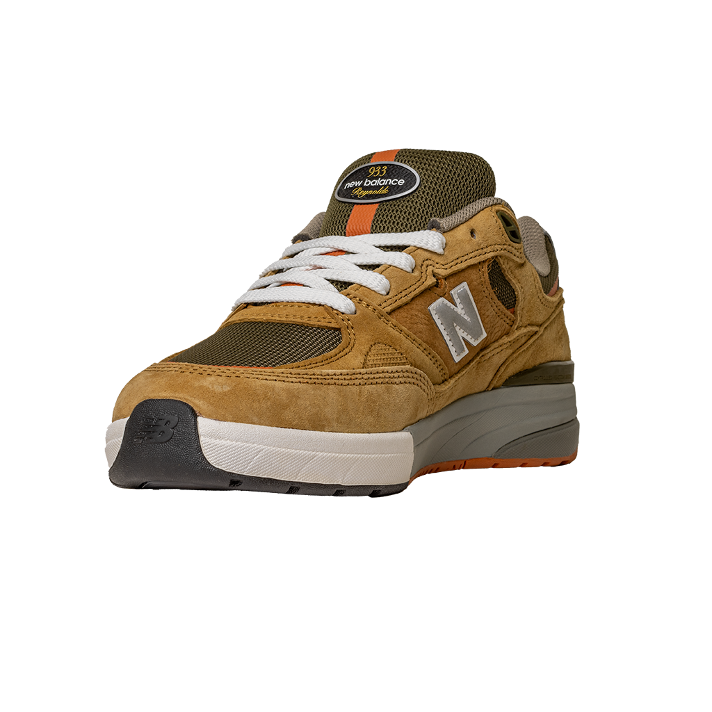 The 933 MNO Andrew Reynolds Brown Grey New Balance Numeric Skateboarding Shoes Suede feature a tan and olive design with white laces, gray sole, orange accents, and an N logo, shown on a plain white background.