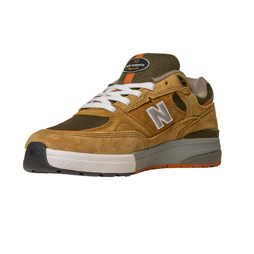 The 933 MNO Andrew Reynolds Brown Grey New Balance Numeric Skateboarding Shoes Suede feature brown and olive green suede, white laces, a white N logo, and a grey-orange sole, shown on a plain white background.