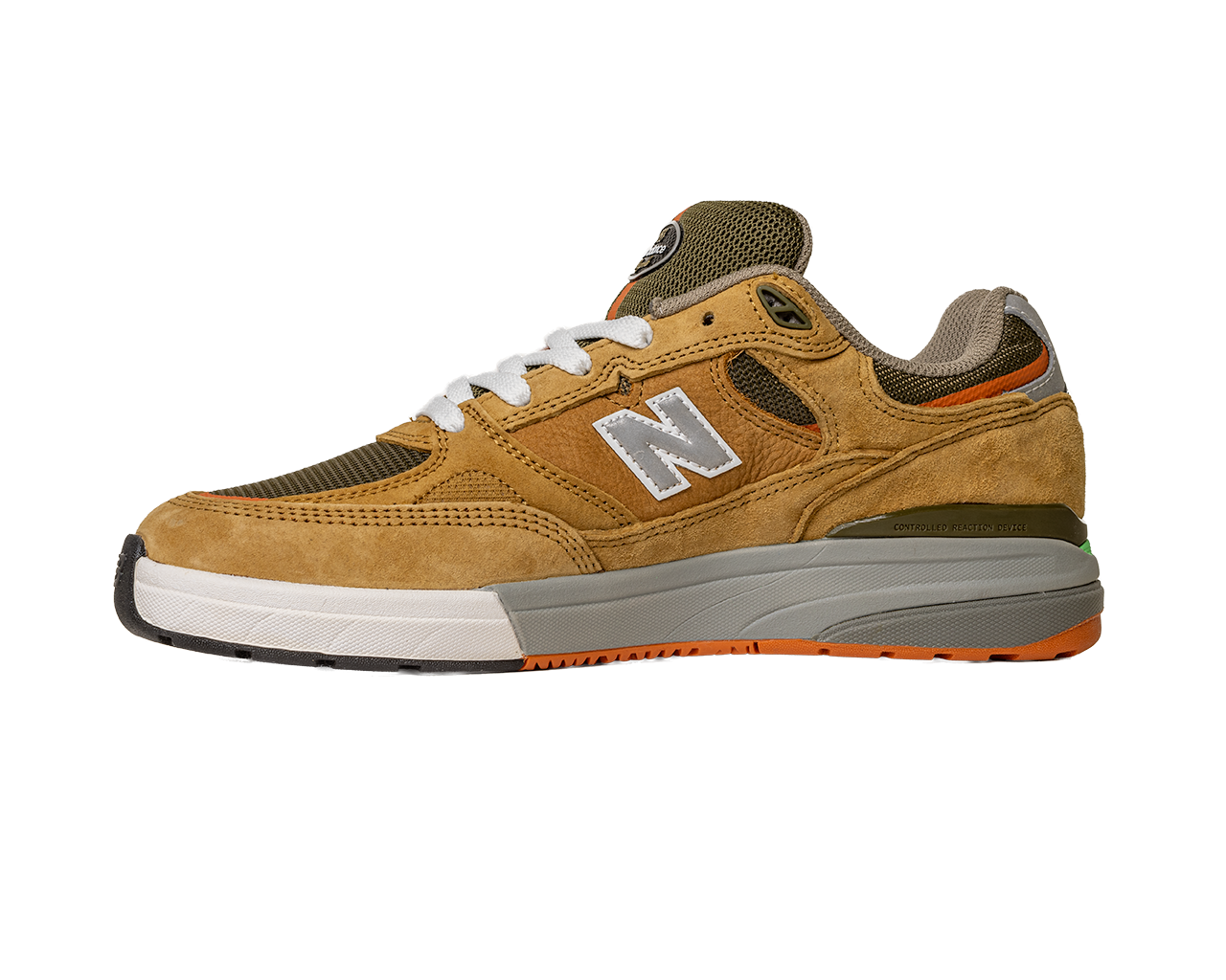 The 933 MNO Andrew Reynolds Brown Grey New Balance Numeric Skateboarding Shoes Suede, featuring a tan and brown design with a white N logo, white laces, and orange-accented sole, is displayed on a white background.