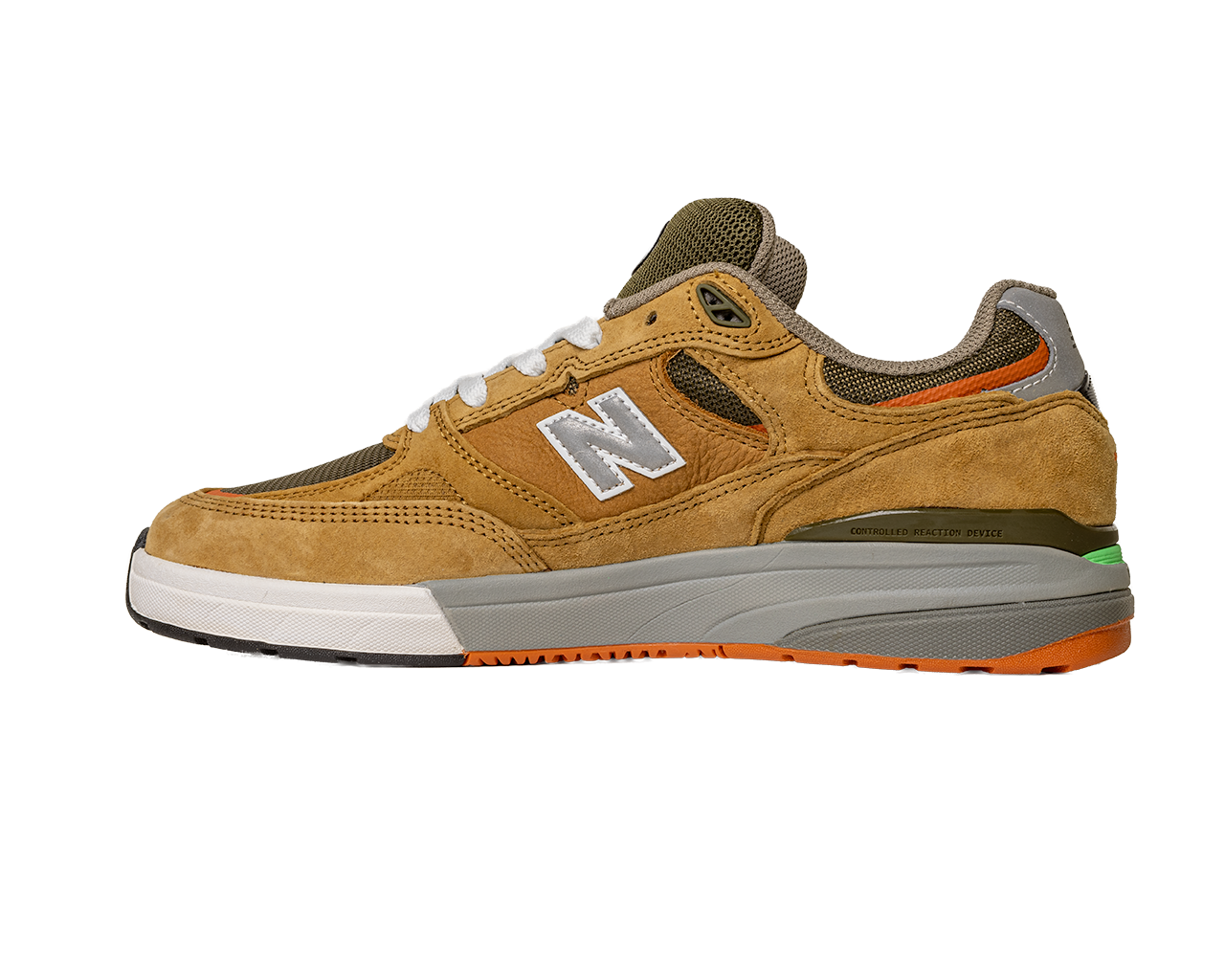 The 933 MNO Andrew Reynolds Brown Grey New Balance Numeric Skateboarding Shoes feature suede, mesh upper, white laces, a white and silver N logo, orange sole detail, and green heel accents—shown in side profile on a white background.