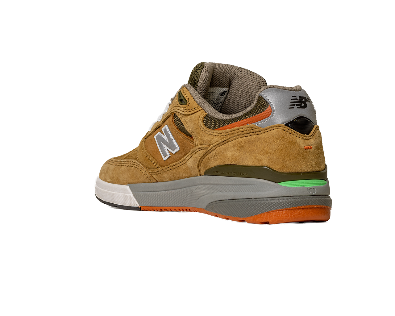 The 933 MNO Andrew Reynolds Brown Grey New Balance Numeric Skateboarding Shoe features tan suede, a white N logo, grey heel, green midsole accent, orange outsole, and white toe. Displayed angled on a plain white background.