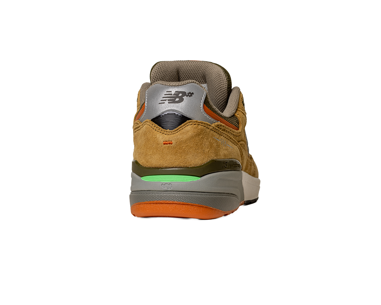 The 933 MNO Andrew Reynolds Brown Grey New Balance Numeric skateboarding shoe features brown suede, a silver heel tab with the New Balance logo, green and orange accents, and a white and gray sole—designed with Andrew Reynolds.