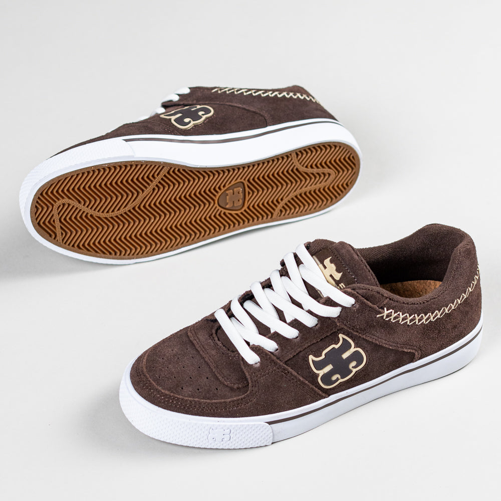 A pair of Kenny Reed Low Vulc Brown Suede I Path Skateboarding Shoes with white laces and soles, tan stitched logo on the side, and decorative stitching by the heel, displayed on a light background.