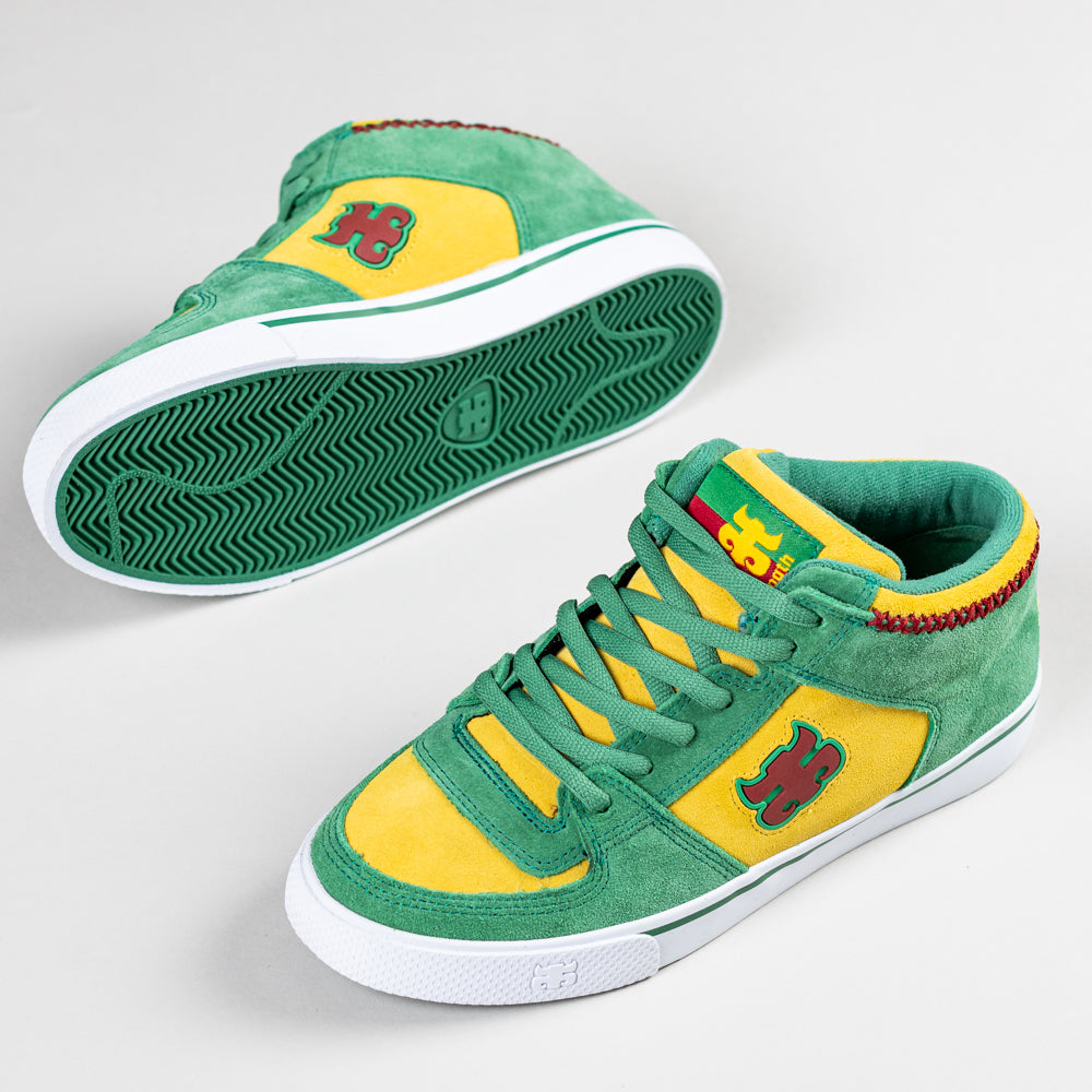 The Kenny Reed Mid Vulc Green Yellow Suede I Path skateboarding shoes feature green and yellow suede uppers, red and yellow accents, a stylized H logo on the side and tongue, green laces, and white textured rubber soles.
