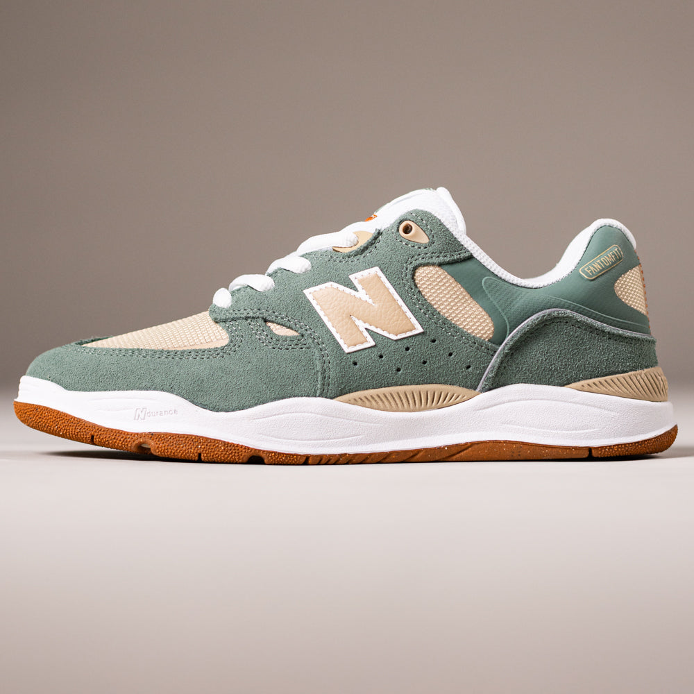 The 1010TC Dark Juniper Sandstone Tiago Lemos New Balance Numeric suede skateboarding shoes feature green and beige suede and mesh, a white sole with gum outsole, side logo, and perforated details against a neutral background.
