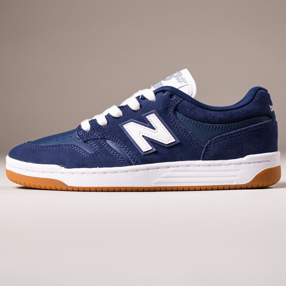 The 480BEE Navy White New Balance Numeric Suede Skateboarding Shoe features a navy upper, white N logo, white laces, white midsole, and gum rubber outsole, shown in side profile against a plain background.
