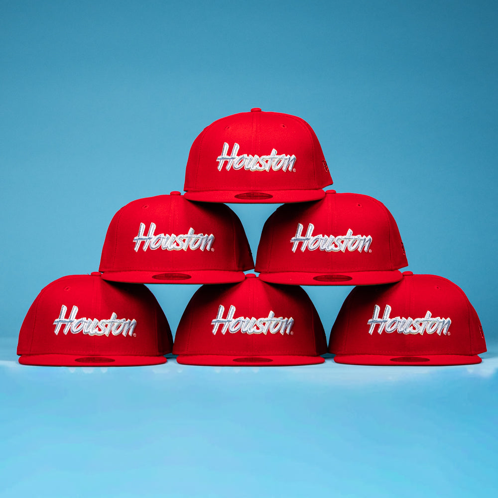 Six Cougar Scarlet 5950 Fitted New Era Hats with "Houston" in white, arranged pyramid-style on a blue backdrop—a striking salute to Houston Cougars pride.