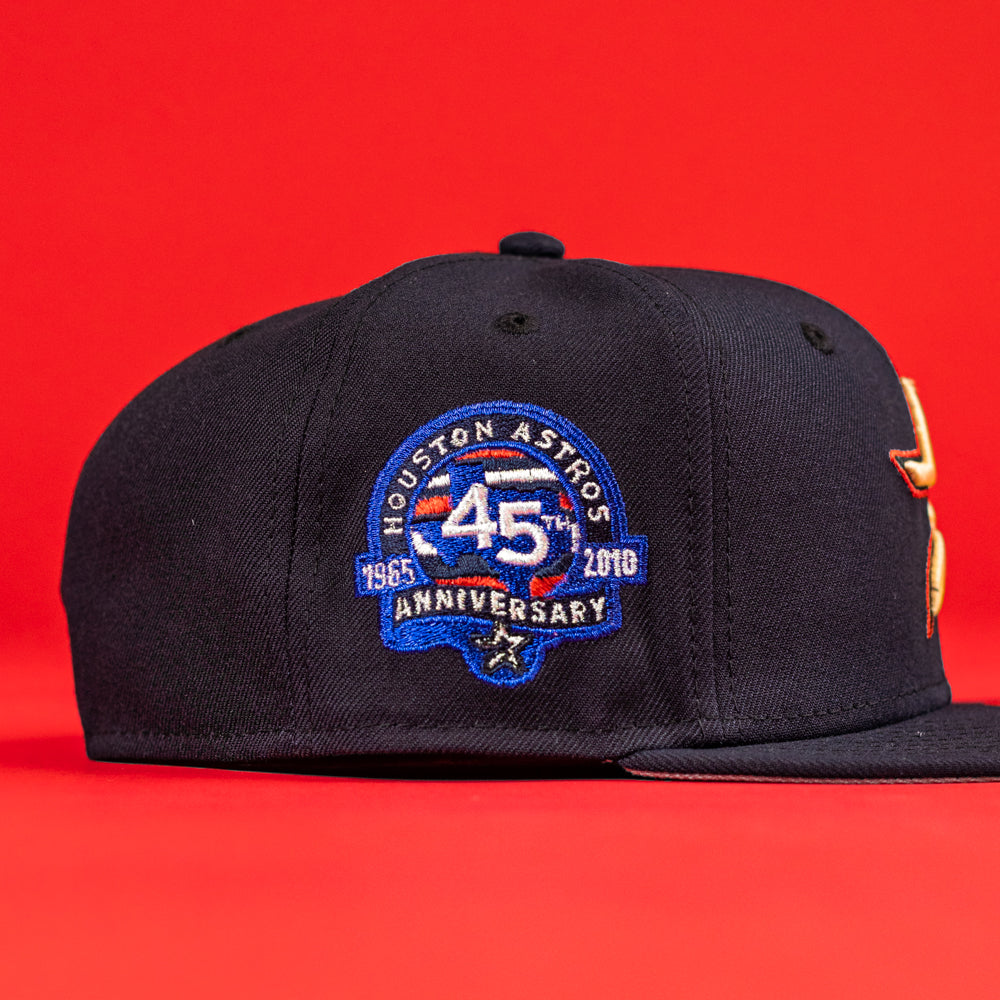 The 6am in Texas Navy Red White New Era Hat 5950 Fitted by Axel Reynoso features a blue, white, and gold Houston Astros 45th anniversary patch (1965–2010) on a bright red background.